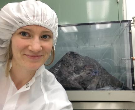 Photo of Kelly Miller and meteorite.