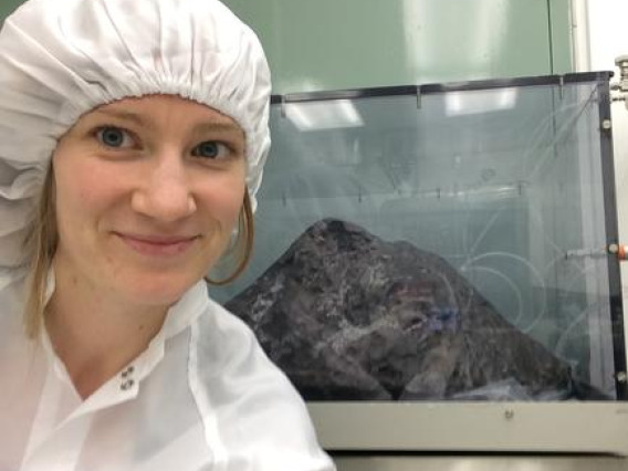 Photo of Kelly Miller with a meteorite.