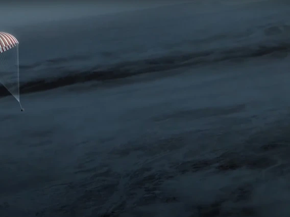 Illustration of OSIRIS-REx capsule parachuting to Earth.