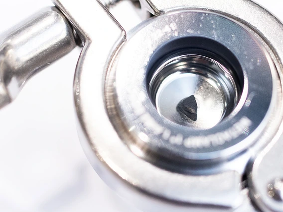 Tucked inside a clear container protected by a metal casing, the pebble collected from asteroid Bennu by the OSIRIS-REx spacecraft is one of only three places in the world to display an extraterrestrial rock sample collected in space, other than the moon. Chris Richards/University Communications