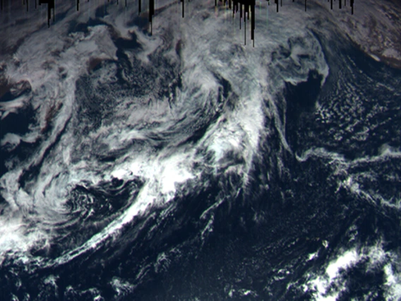 On Sept. 22, at a distance of 105,600 miles, the OSIRIS-REx MapCam captured this color image of Earth. Dark "icicles" at the top of the image were caused by short exposure time.
