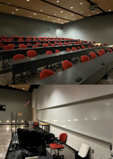 Image of Room 114A including 128 seats and speaker desk in front of double, sliding white boards